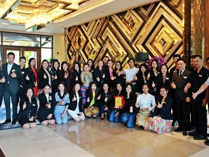 Staff posing at the entrance of Chatrium Royal Lake Yangon