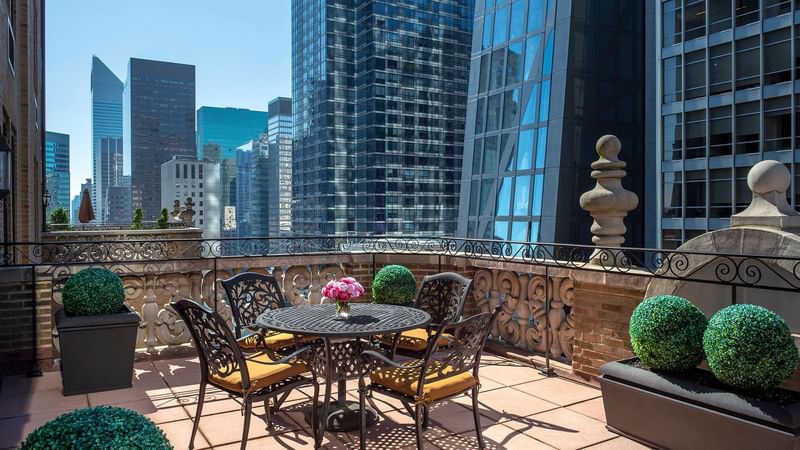 Dining table on a balcony in Suite of the Stars at Warwick New York