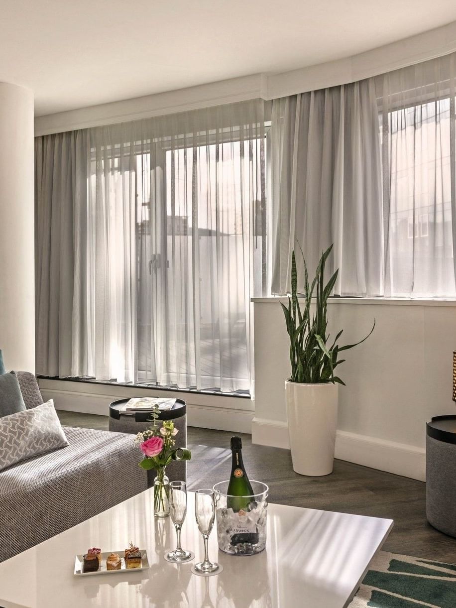 Elegant living area of the Penthouse Drummond at Warwick Le Crystal Montreal.