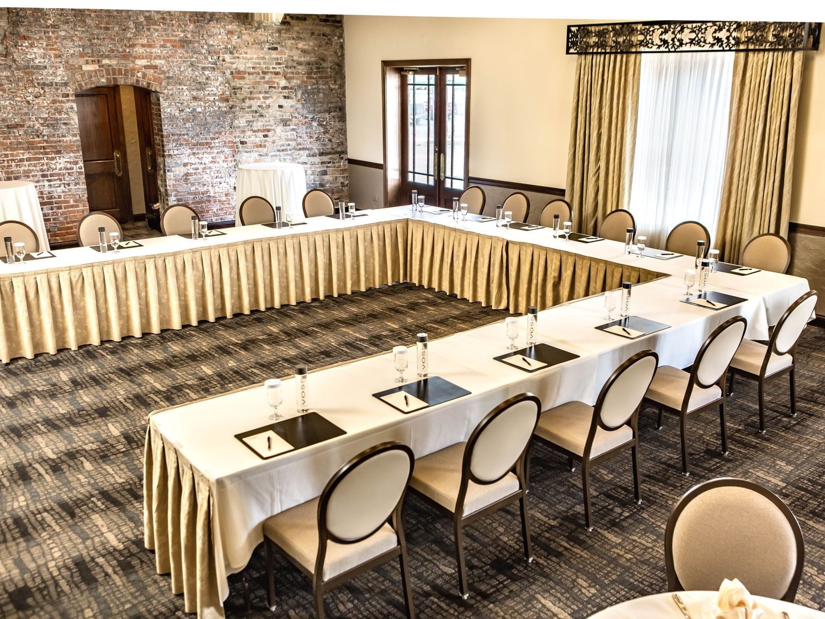 a u-shaped table in a large room