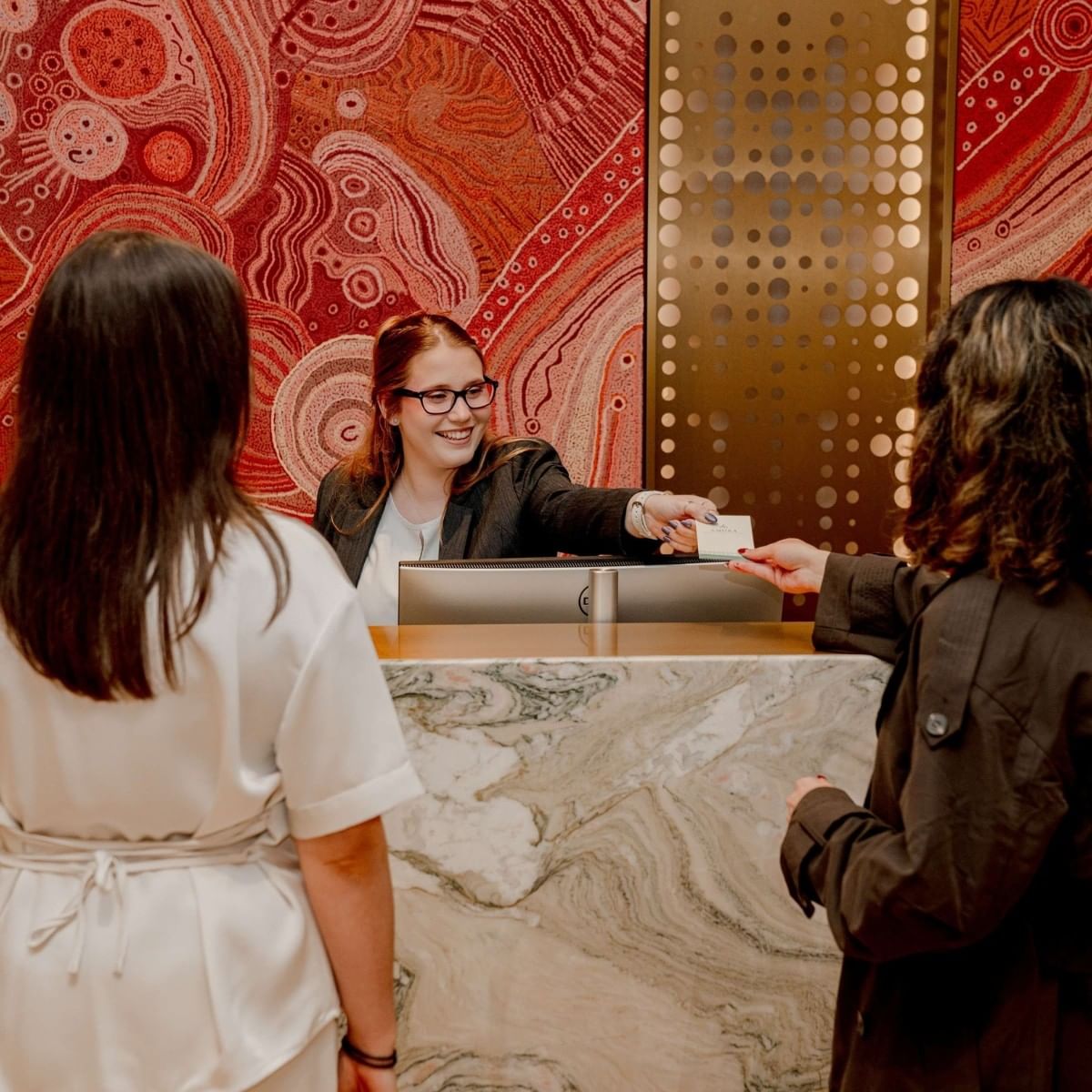 Amora team welcoming guests