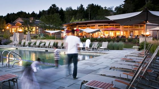 A family by the pool area at Topnotch Stowe Resort