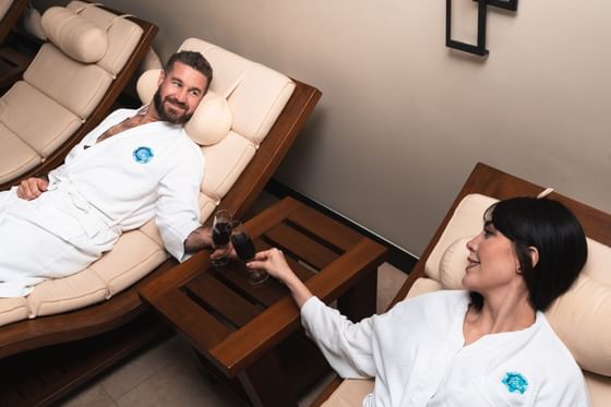 Couple having wine & relaxing in the Spa, Hotel Coral y Marina