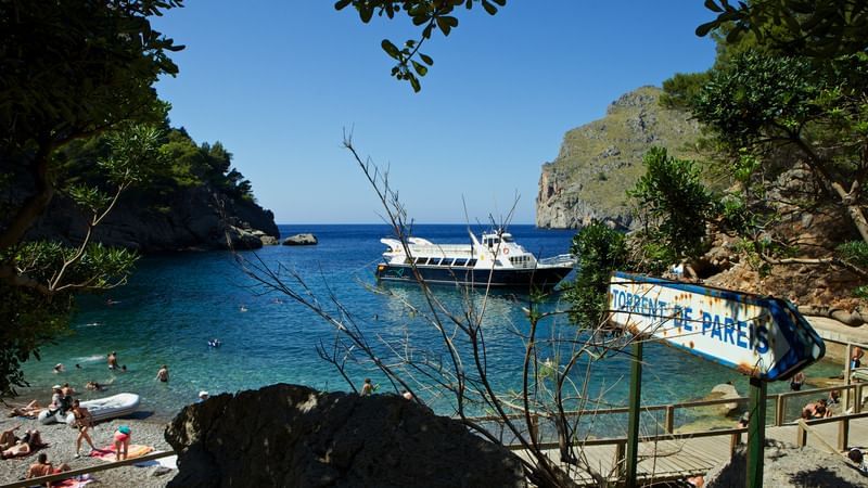 Excursion Port de Soller, Sa Foradada, Cala Tuent. Visit the viewpoint of sa foradada with blue boats sa calobra