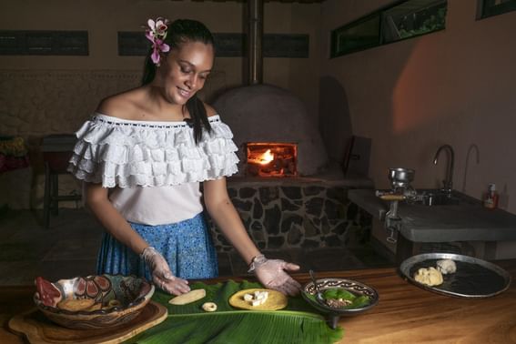 Woman posing while cooking in kitchen at Buena Vista Del Rincon