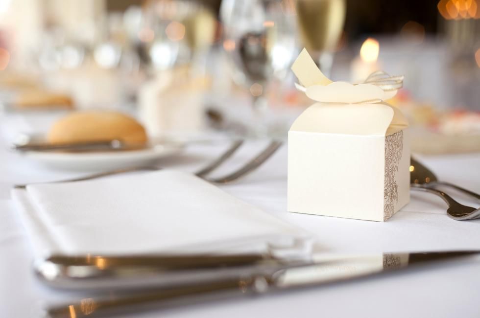 wedding breakfast set up with gift on table at gorse hill in surrey