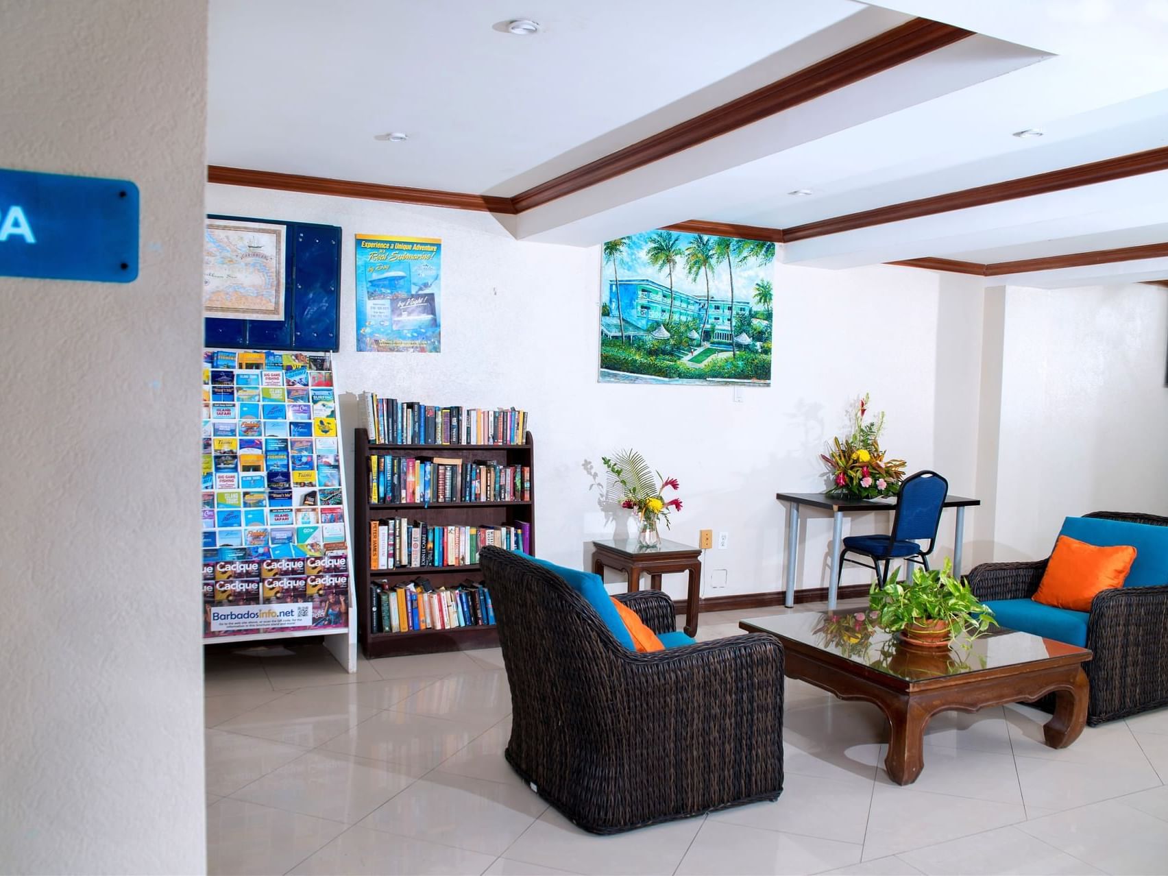 Lounge area with book shelves & workspace at Dover Beach Hotel