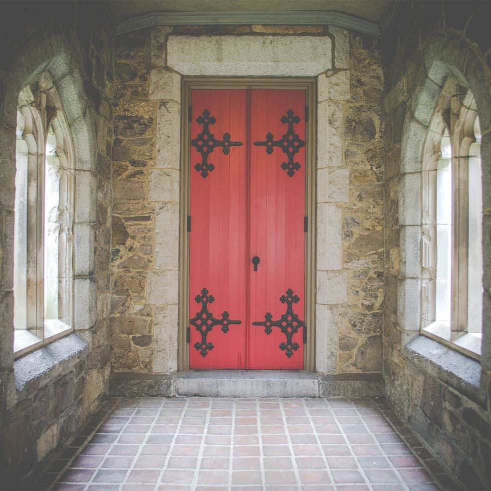 Interior of the Escape Room and red door near Falkensteiner Hotel Prague