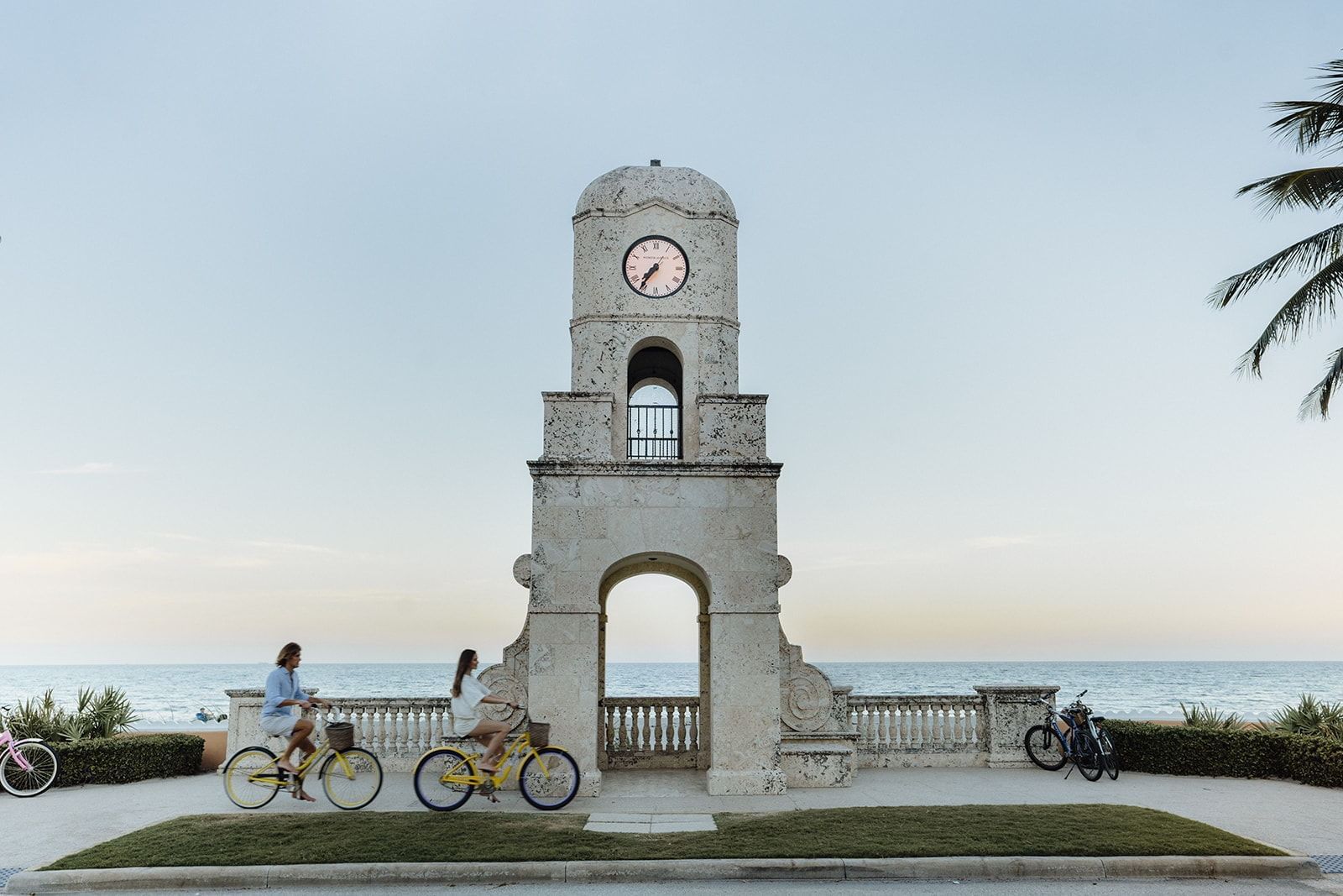 A couple cycling at Norton Museum near the Brazilian Court