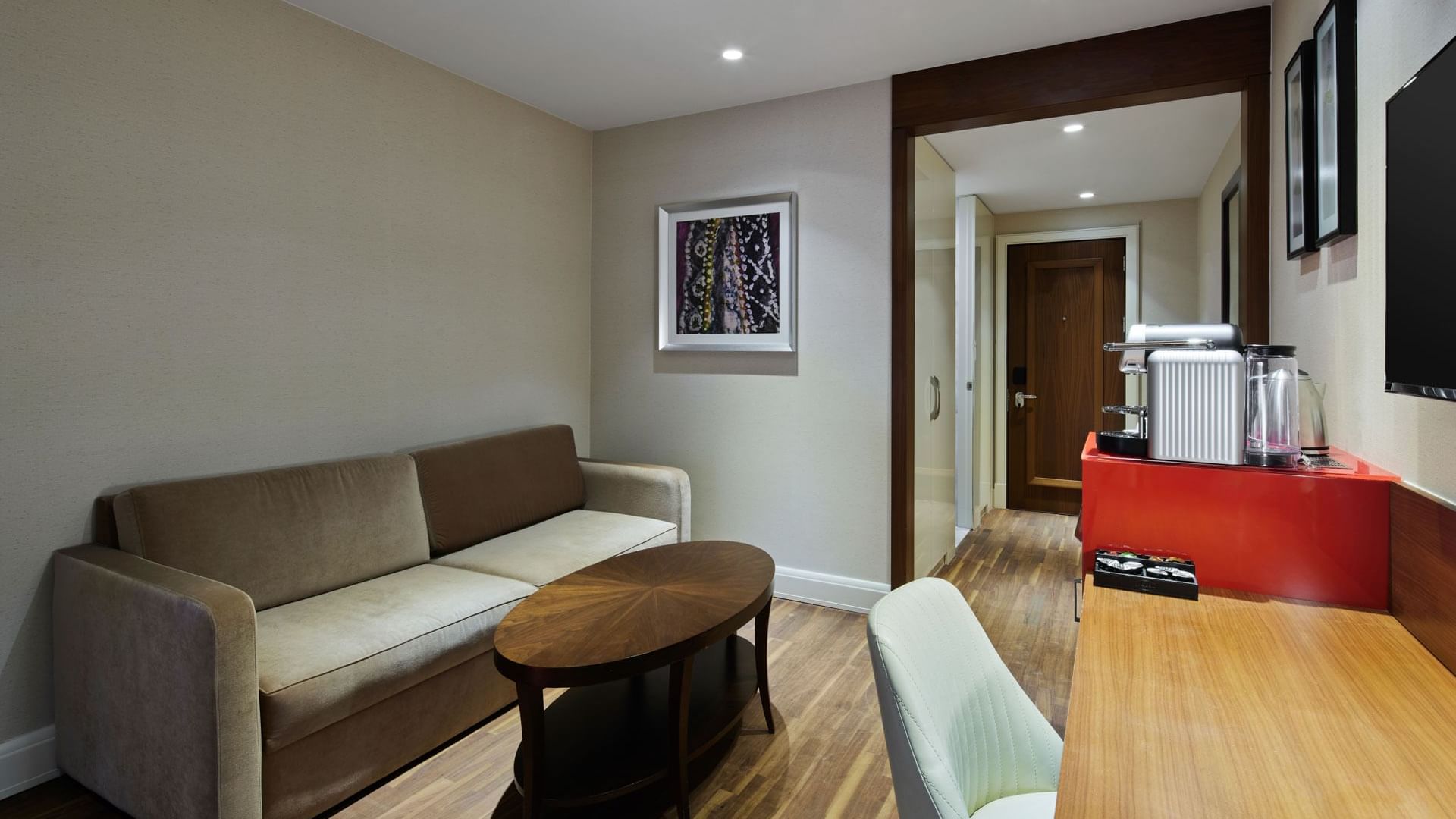 Lounge area with work desk & Nespresso machine in Titanic Duplex Suite at Titanic Gendarmenmarkt Berlin
