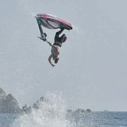 A jet ski rider performing in the sea near Cala de Mar Resort