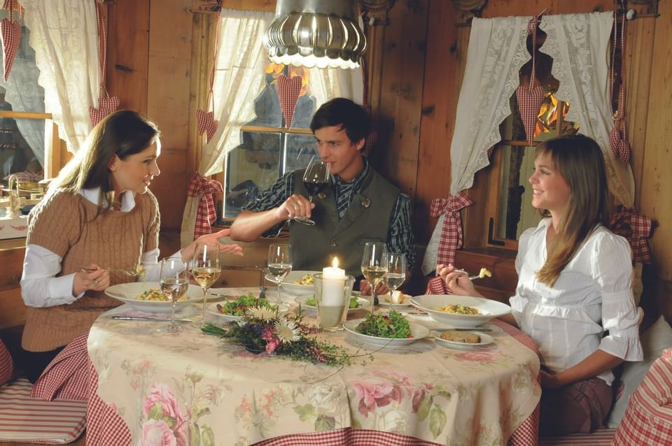 A family having dinner at Liebes Rot Flueh