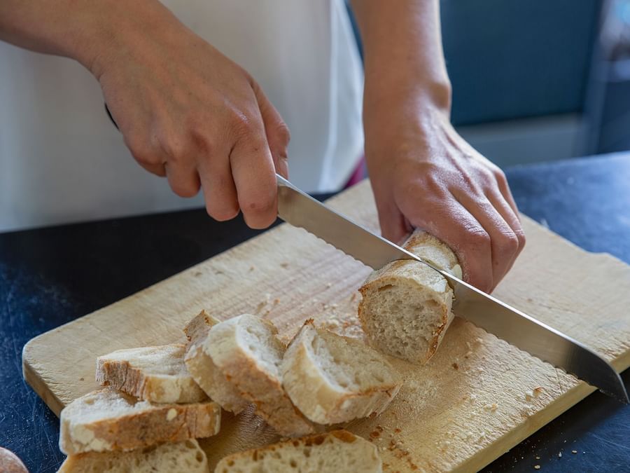 Closeup of slicing bread at Hotel Marytel