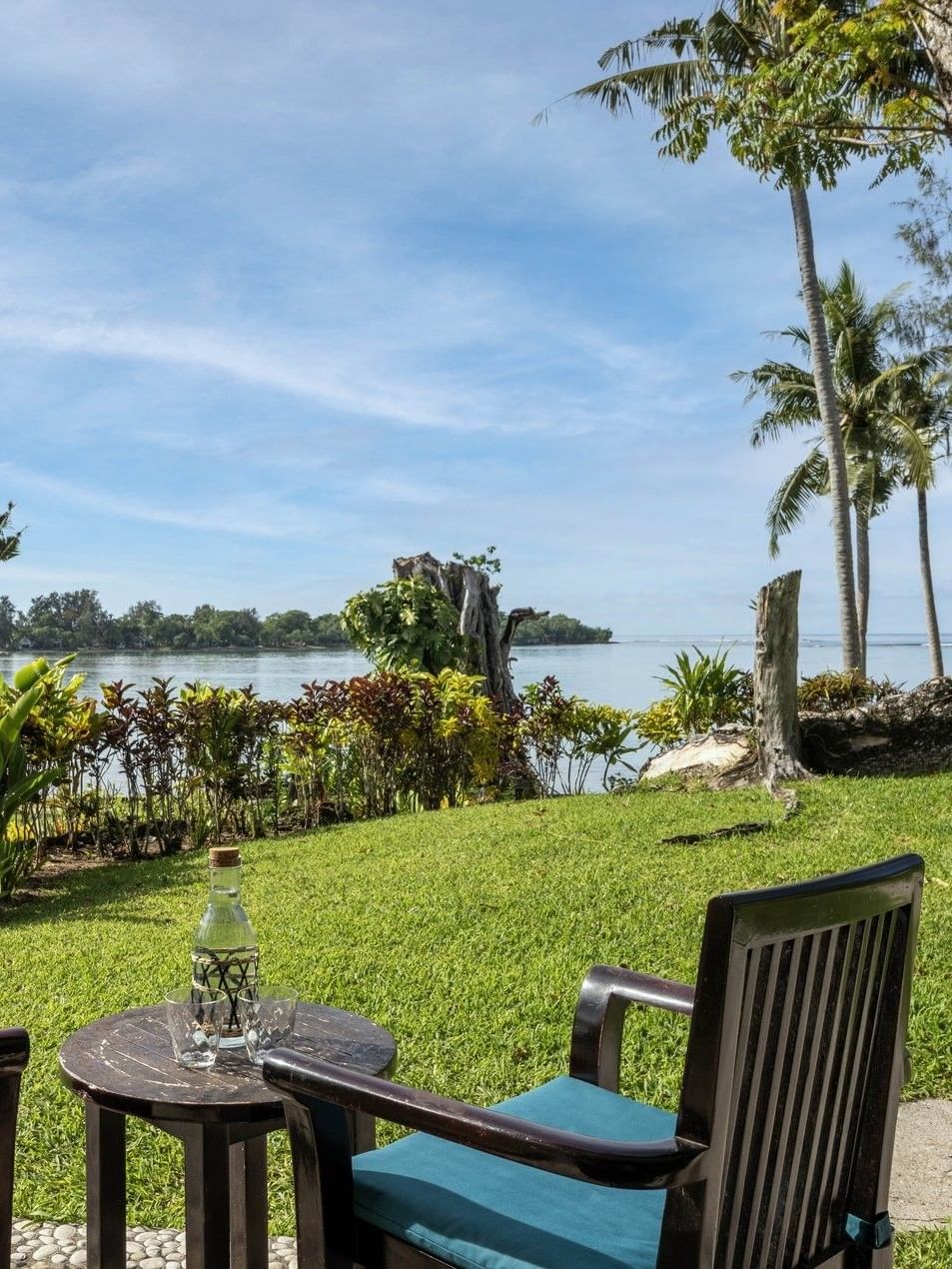 Scenic outdoor seating area on a lush green lawn in Lagoon View Room Terrace at warwick le lagon-vanuatu
