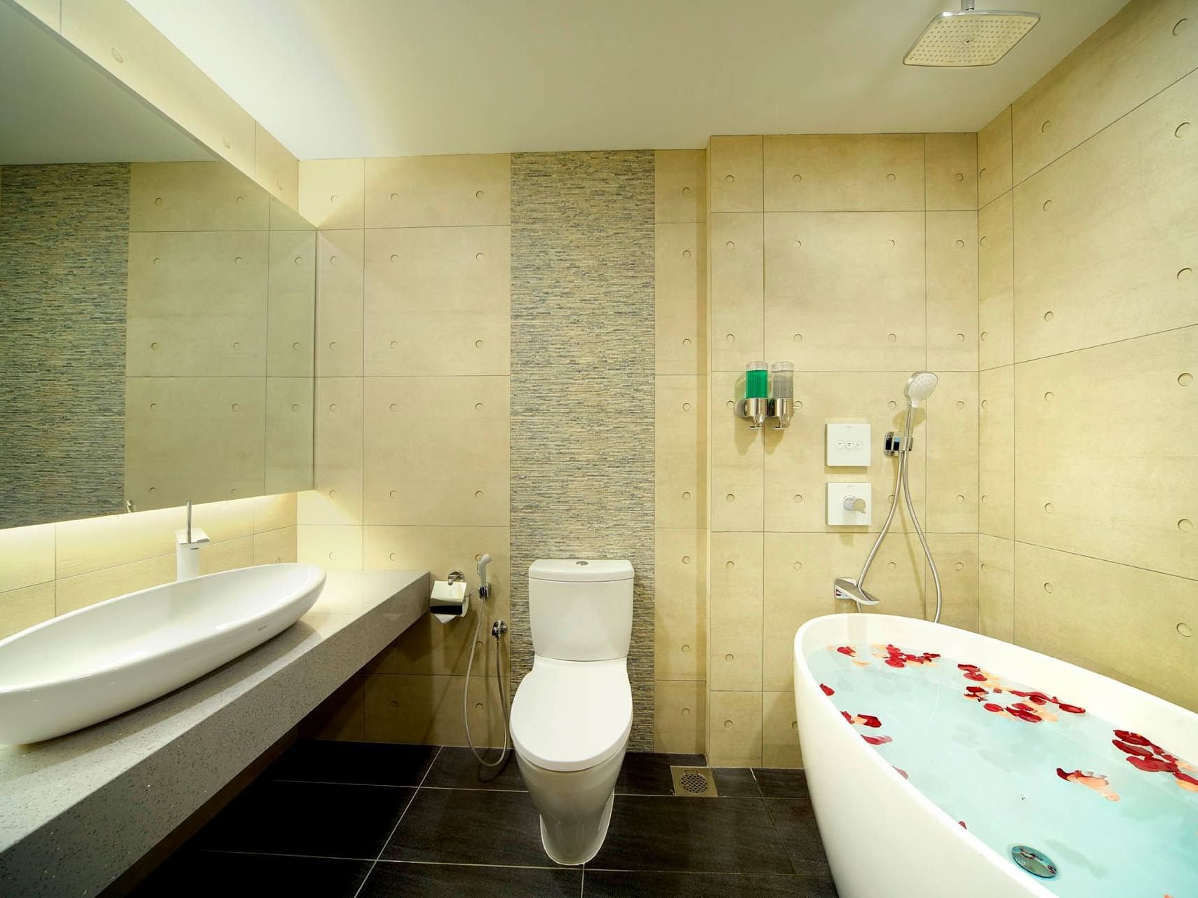 Image 73: Modern bathroom with rose-petal tub, sleek sink, and tiled walls in Two Bedroom at Orchard Grand Court