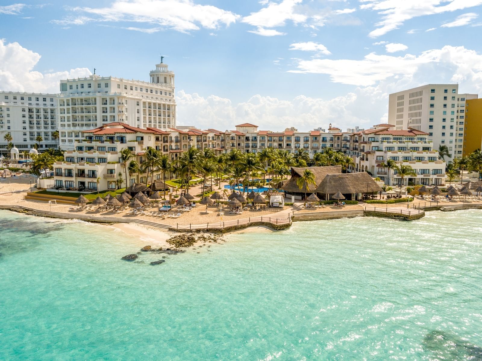 Distant exterior view of hotel & beach at Live Aqua Resorts