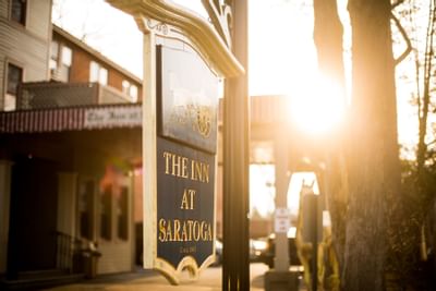 Signboard of Inn at Saratoga through morning sun rays