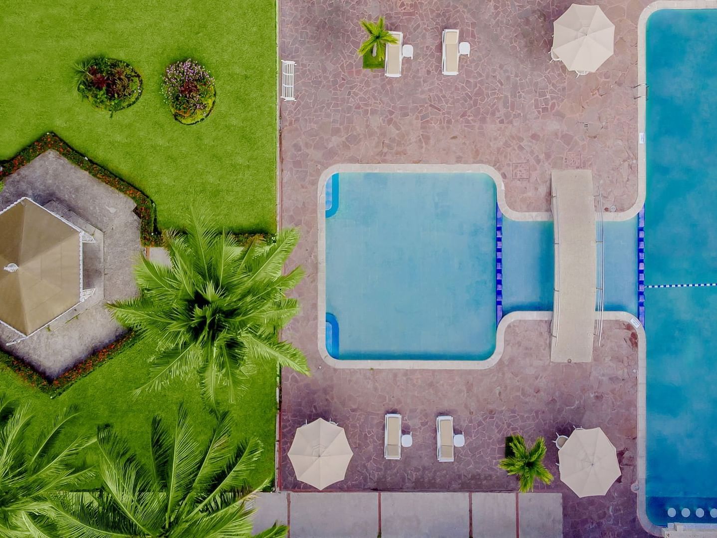 Top view of the swimming pool area & garden at Gamma Hotels