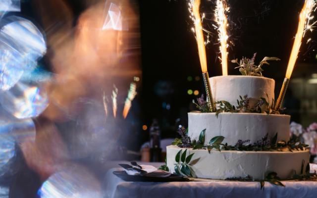 wedding cake topped with sparklers