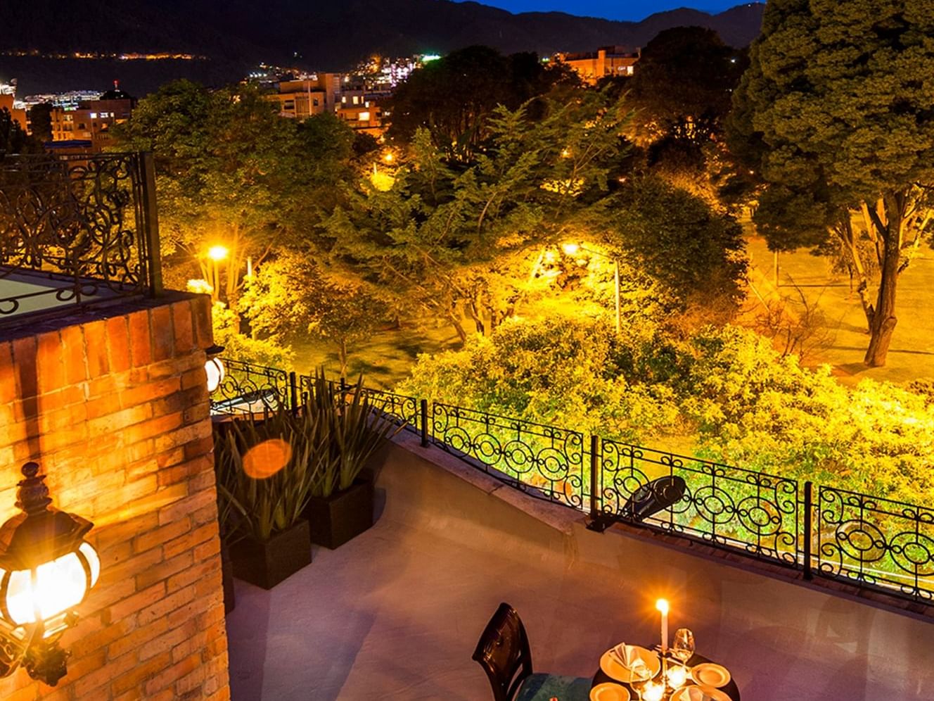 A night view of the cityscape from a terrace at Le Manoir Bogotá Hotel