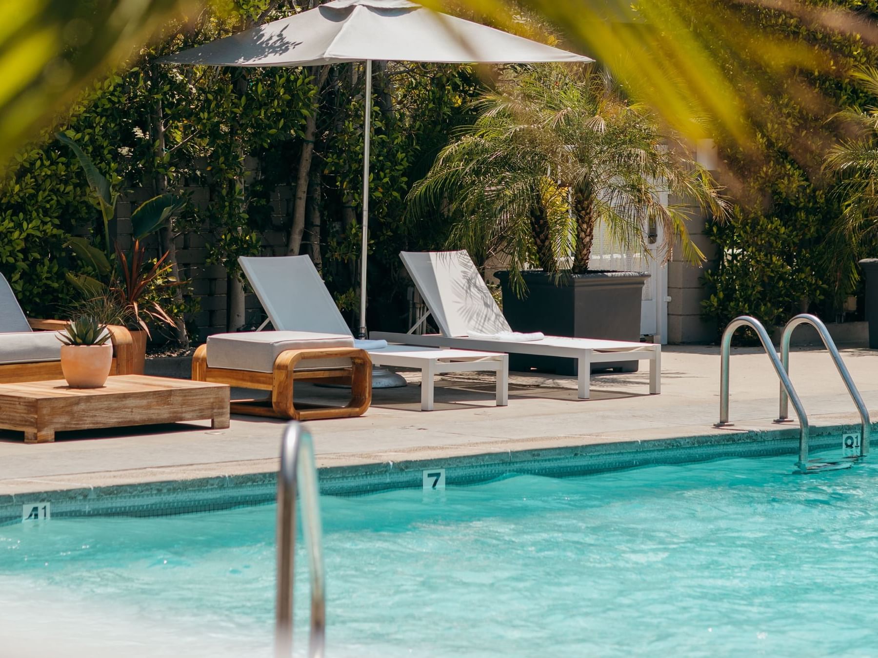 Poolside image featuring pool lounge chairs