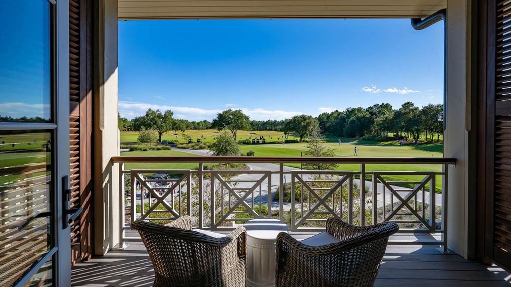 Balcony lounge area in Driving Range View King Room With Balcony at Camp Creek Inn