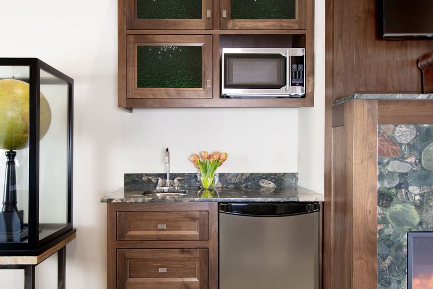 Kitchenette with appliances in King Premiere Library at Retro Suites Hotel