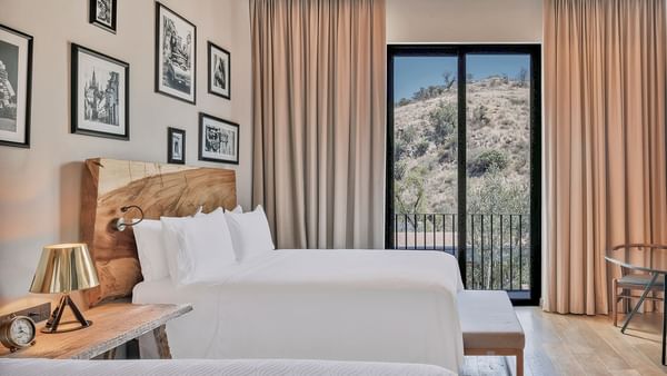 Comfy bed and city view in Garden View Room at Live Aqua Resorts