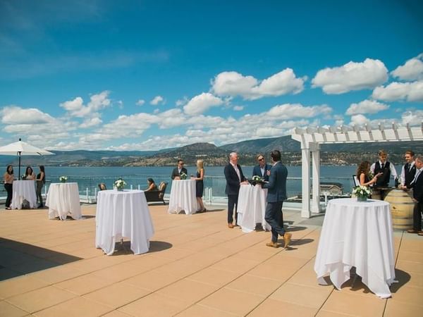 Outdoor cocktail tables with lake view at Hotel Eldorado