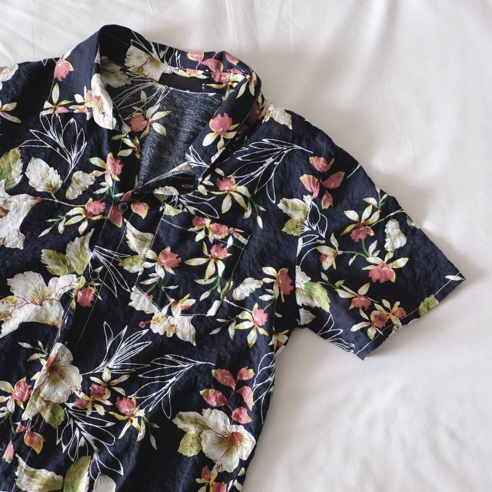 Close-up of Hawaiian inspired floral shirt placed on the bed at Waikiki Resort Hotel by Sono