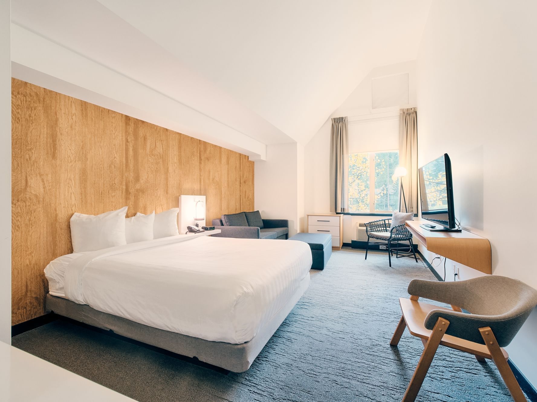 Queen bed, TV in Deluxe Queen + Sofa Bed at Aava Whistler Hotel
