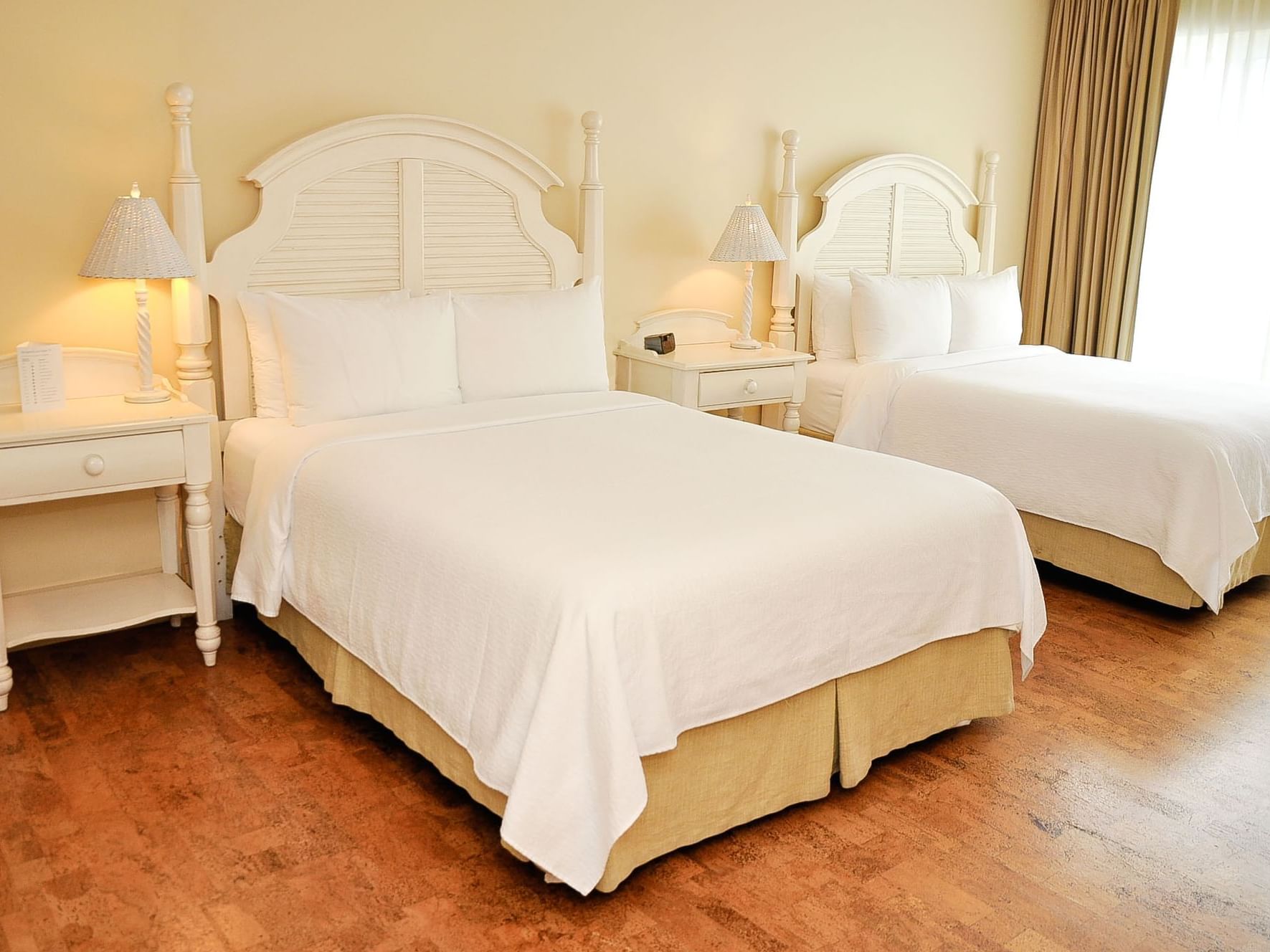 Twin beds in Arms 2 Queens Room at Hotel Eldorado
