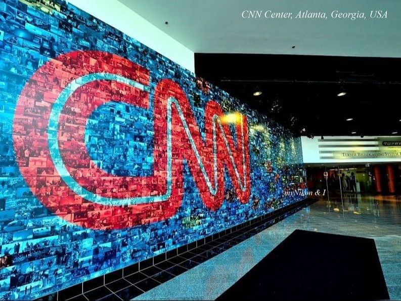 Large wall with the CNN logo near Artmore Hotel