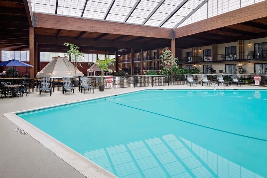 Indoor pool & loungers at Boxboro Regency Hotel
