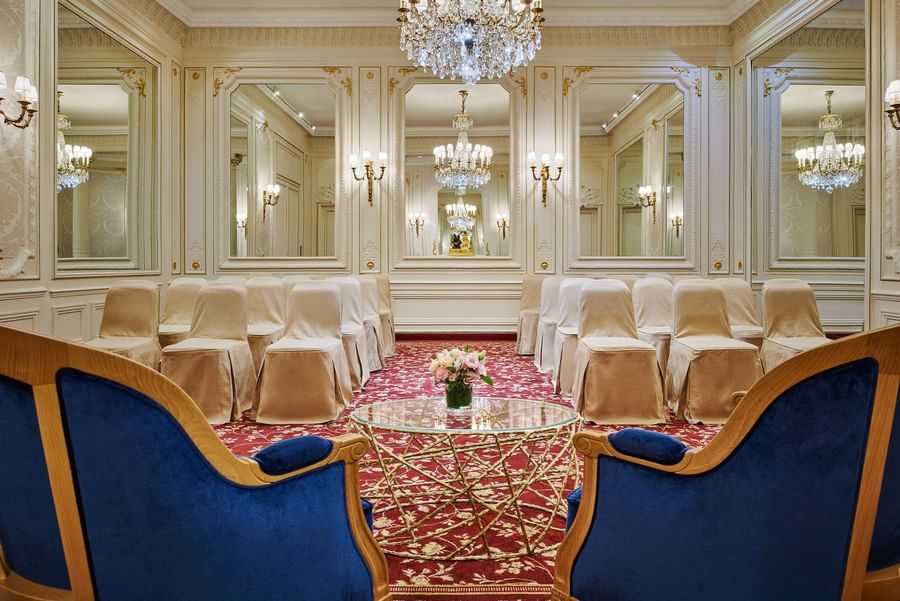 Armchair with a glass coffee table facing the theater set up in Capucines Meeting Room at Hotel Westminster Paris