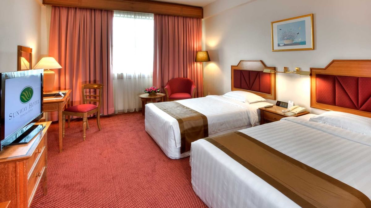 Wall-mounted water dispenser with a bottle in Family Suite at Sunway Hotel Big Box