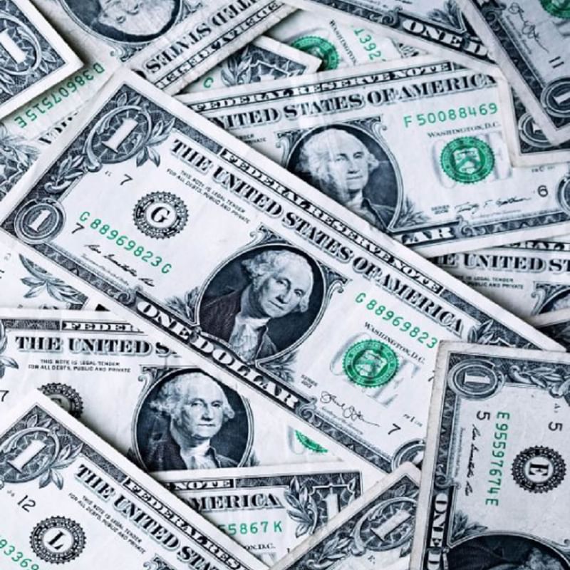 Close-up of a pile of dollar bills at Warwick Seattle