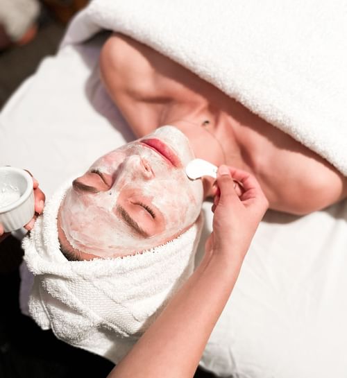 Lady having a facial treatment in the spa at Hotel Eldorado
