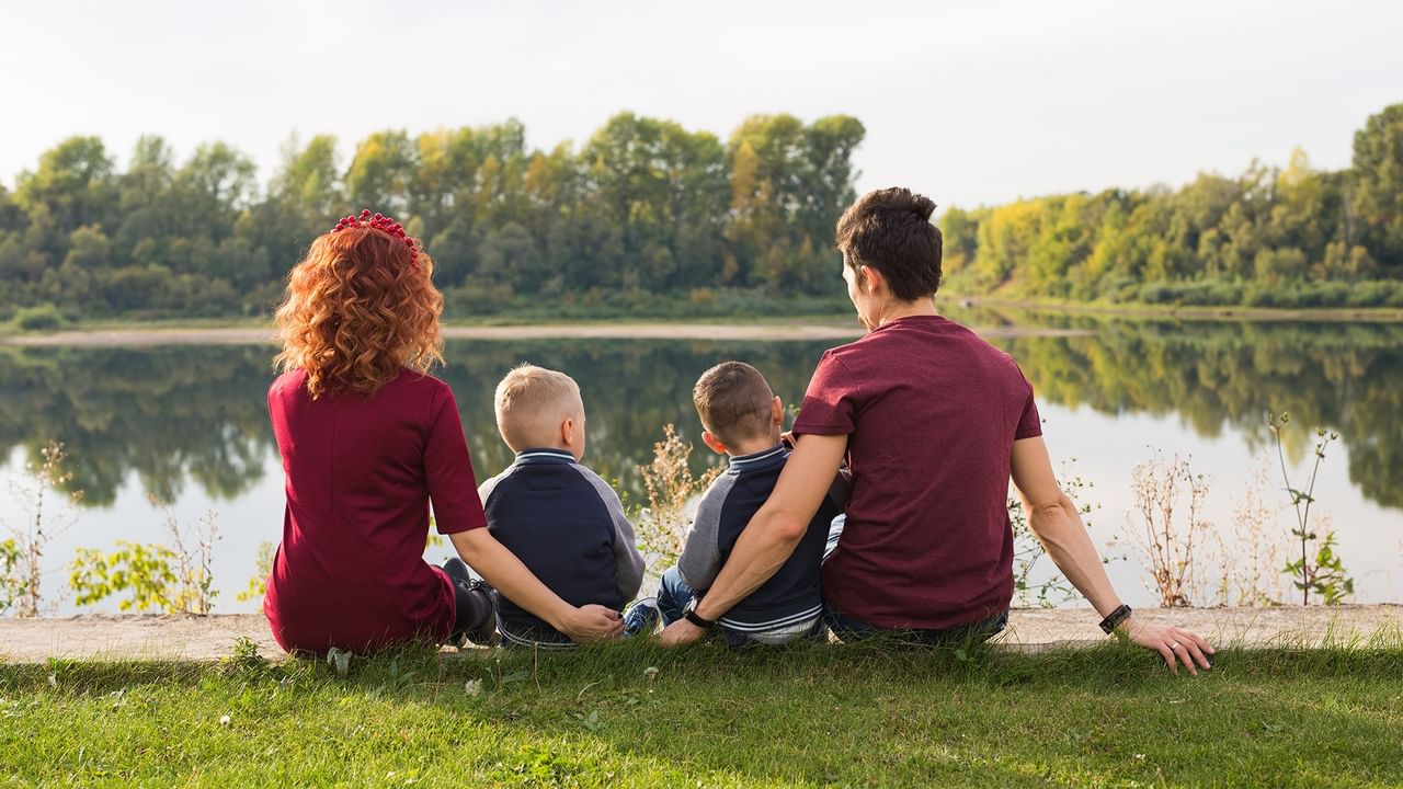 family enjoying peaceful lakeview by the water