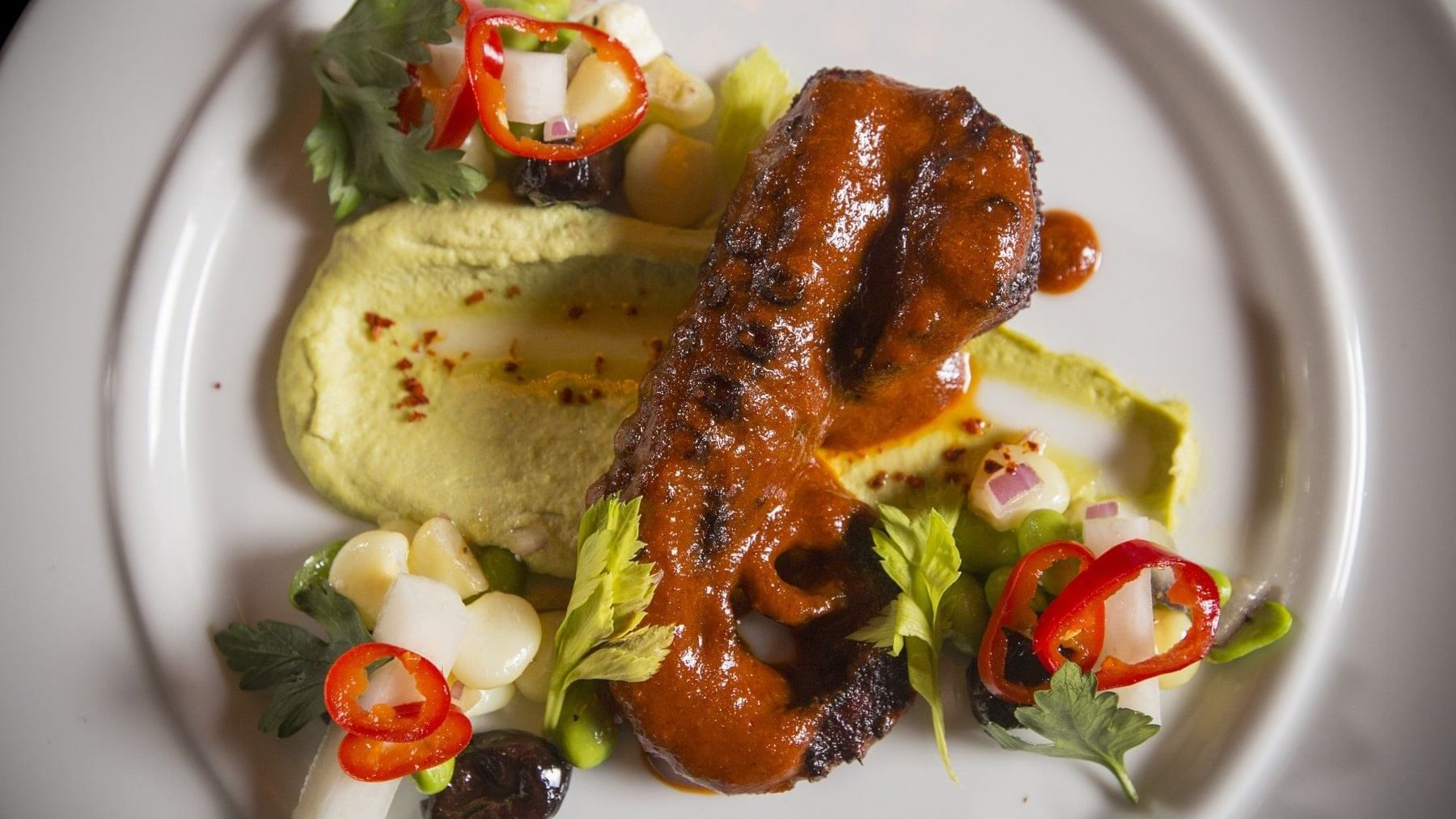 An appetizing meat dish served on a plate in Diplomat Prime at The Diplomat Resort