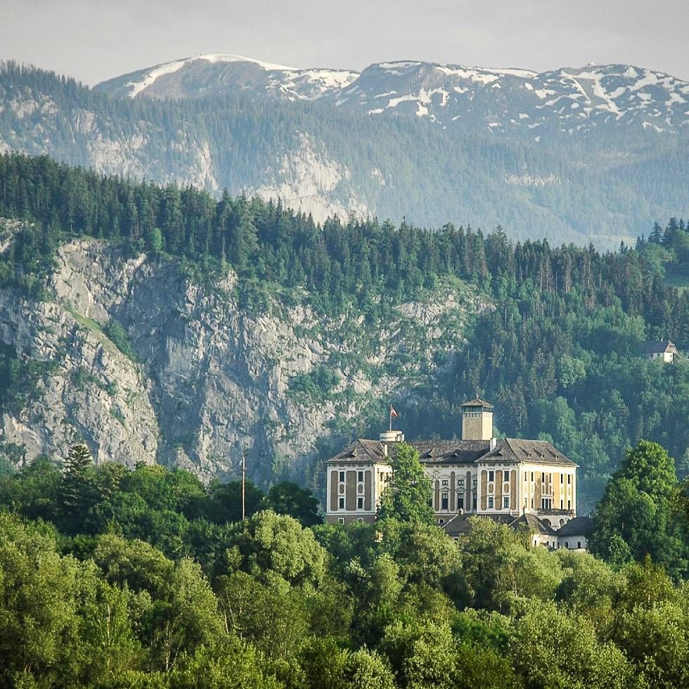 Distant view of Trautenfels Castle surrounded by lush greenery near Falkensteiner Hotel Schladming