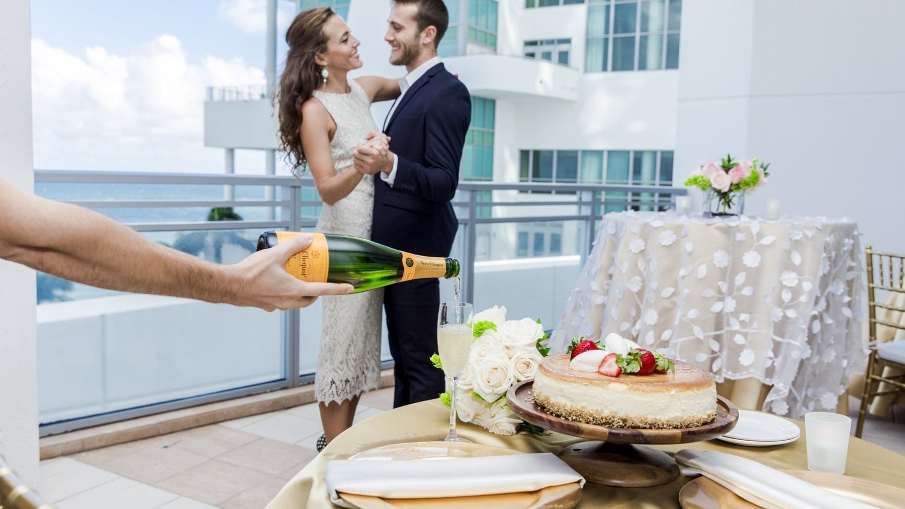 Wedded couple posing by terrace at The Diplomat Resort