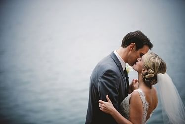 Newlyweds sharing their first kiss
