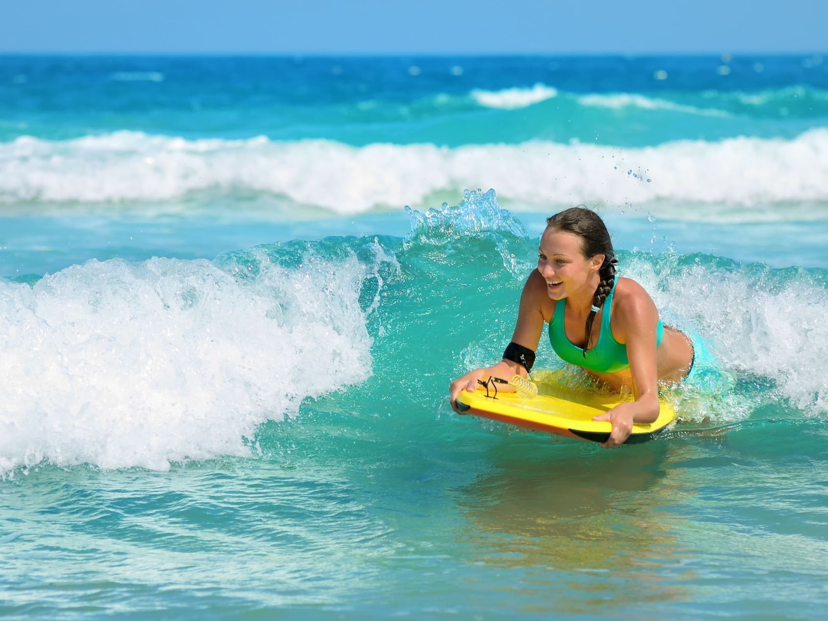 Close-up on a girl surfing near Southern Palms Beach Club