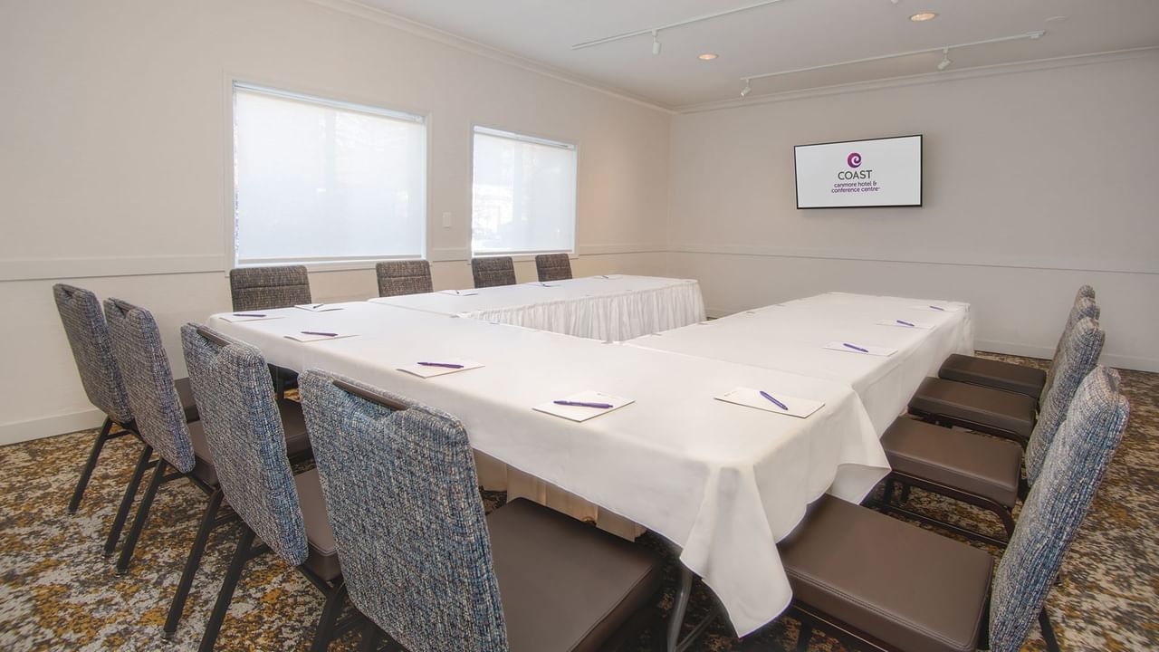 A conference room with long tables.