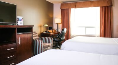 Two guest beds, desk and TV