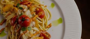 Close-up of a served seafood spaghetti plate at EMME Restaurant