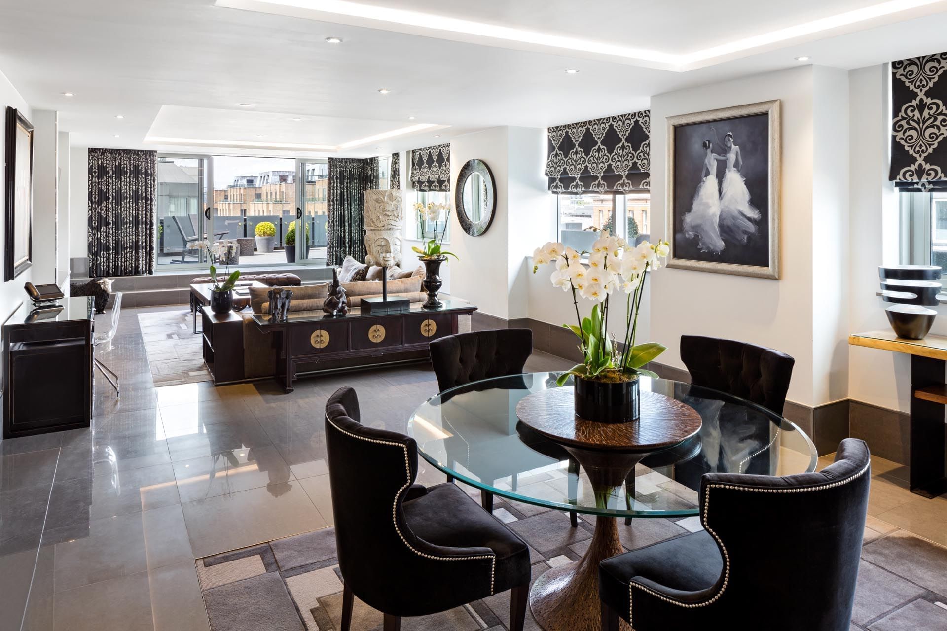 Ebony Suite with a dining area, living space, and terrace at The May Fair Hotel
