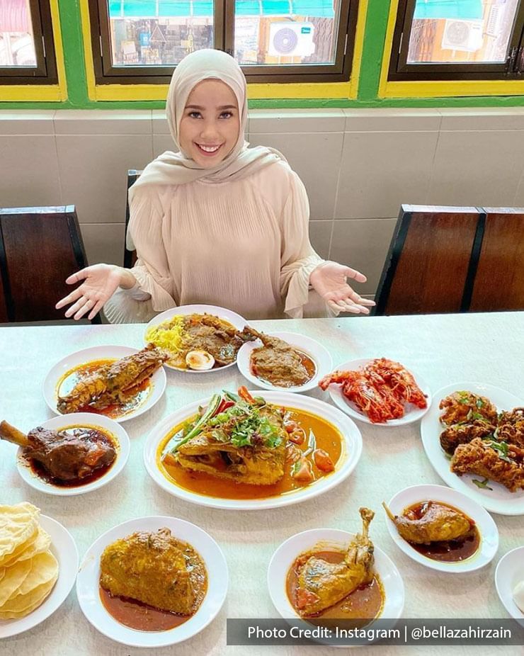 a Malaysian artist Bella Zahirzain with various types of curries and other dishes