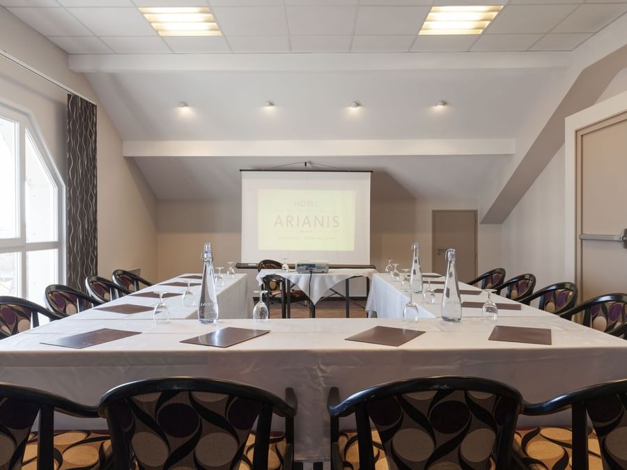 Board room arrangement with projector at Hotel Arianis
